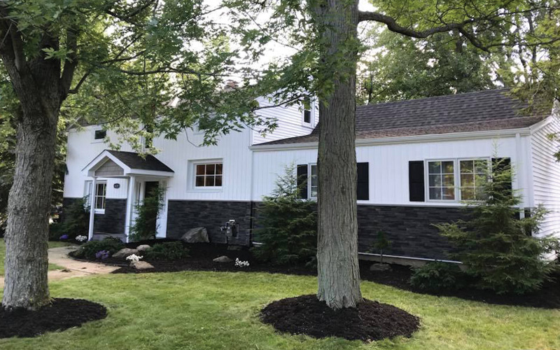 Exterior of a home with stone and siding