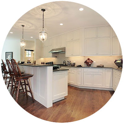 Kitchen with white cabinets and black countertops