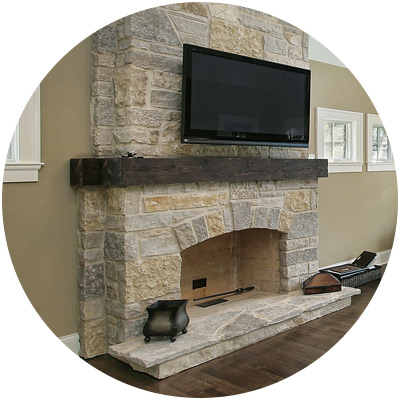 Indoor stone fireplace with TV